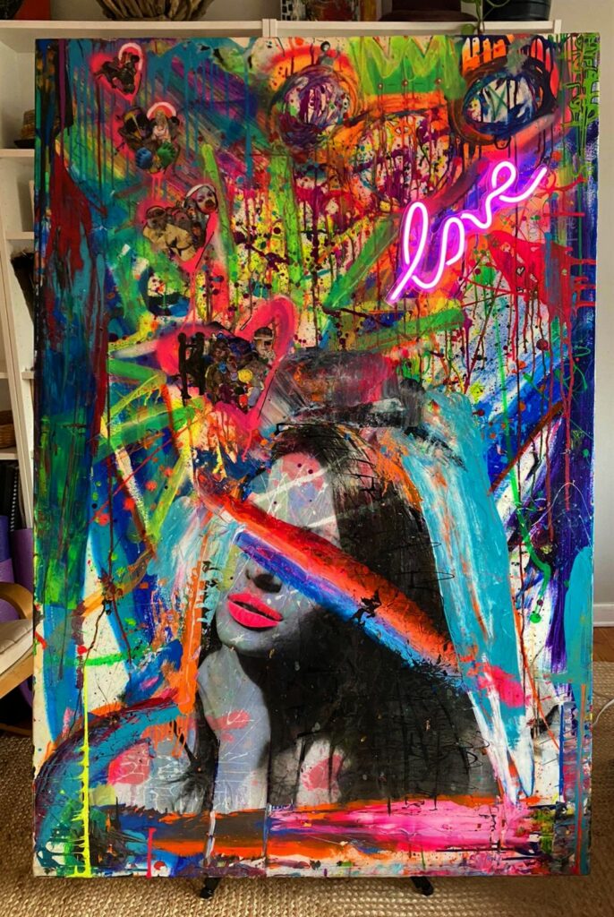 abstract painting with a woman's face at the bottom of the image, a neon image of the word love, bright colored swathes of paint, including drips
