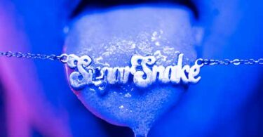 An open mouth with the tongue licking a pendent that reads, "SugarSnake."