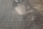 A black and white image of the Mona Lisa with a person’s face superimposed onto it.