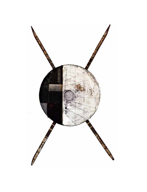 Circular shield with two crossed chop-stick like stakes behind the shield.  