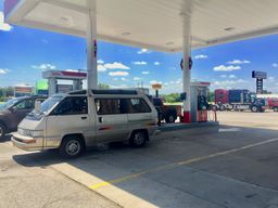 photo of the Toyota van at a gas station