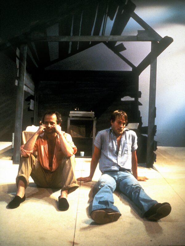 photograph of two men sat on the stage of a theatre for the production of a Tennessee Williams play