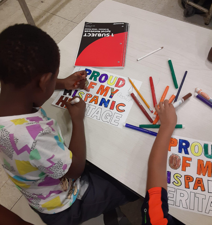 Child creating artwork at the Woodycrest after school Program